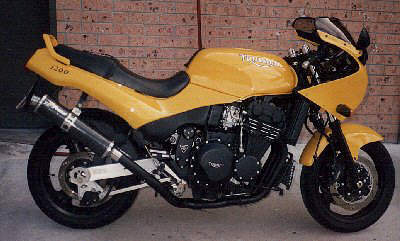 Triumph 1200 with carbon canister Foran Exhaust