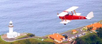 Tiger Moth over Cape Byron Lighthouse
